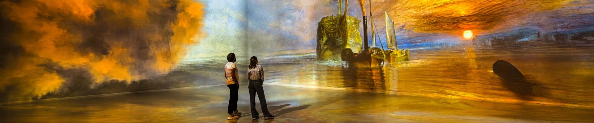 models standing in the world around us gallery at the frameless immersive art experience